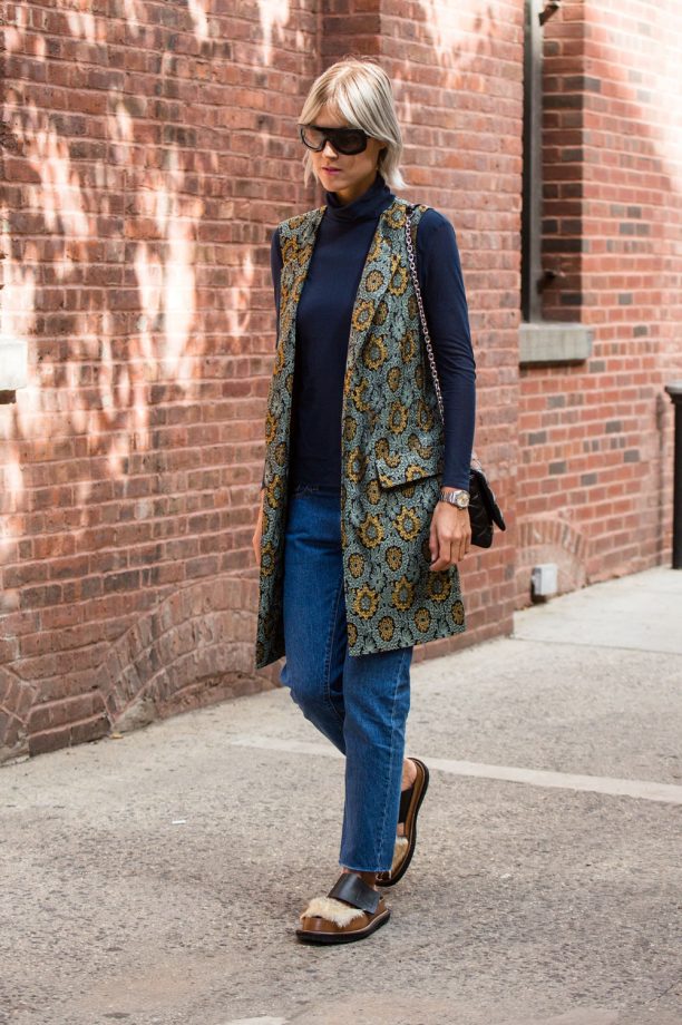 Linda Tol Teams A Sleeveless Jacket With Fluffy Sandals For Transitional Perfection