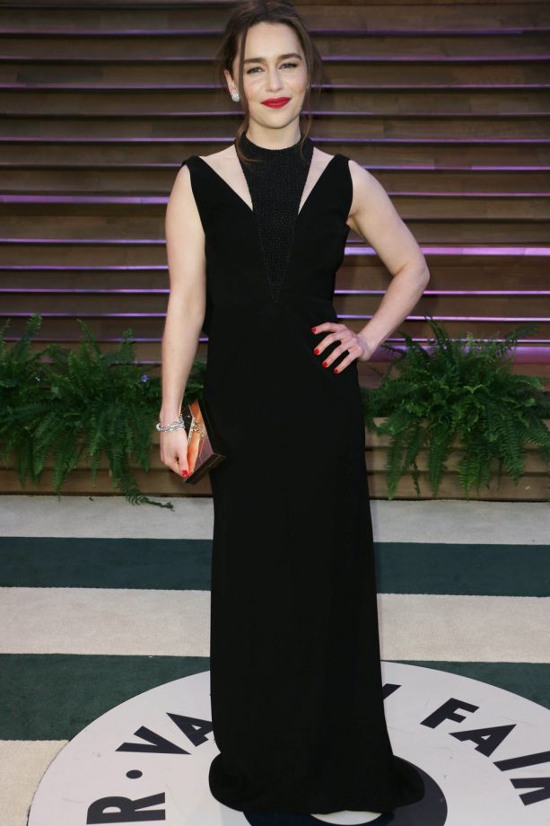 Emilia Clarke Chooses A Black Cut-Away Gown At The Vanity Fair Party, 2014