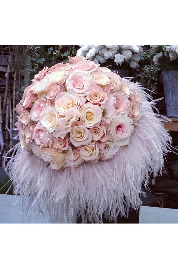 Pretty Pastel Roses And Feathers Make For A Stunning Bouquet