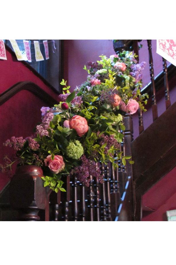 Flowers Streaming Down The Banisters For A Decadent Feel
