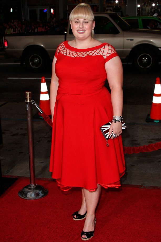 Rebel Wilson Pairs Up A Union Jack Clutch With A Red Dress At The LA Premiere Of 'Paul', 2011