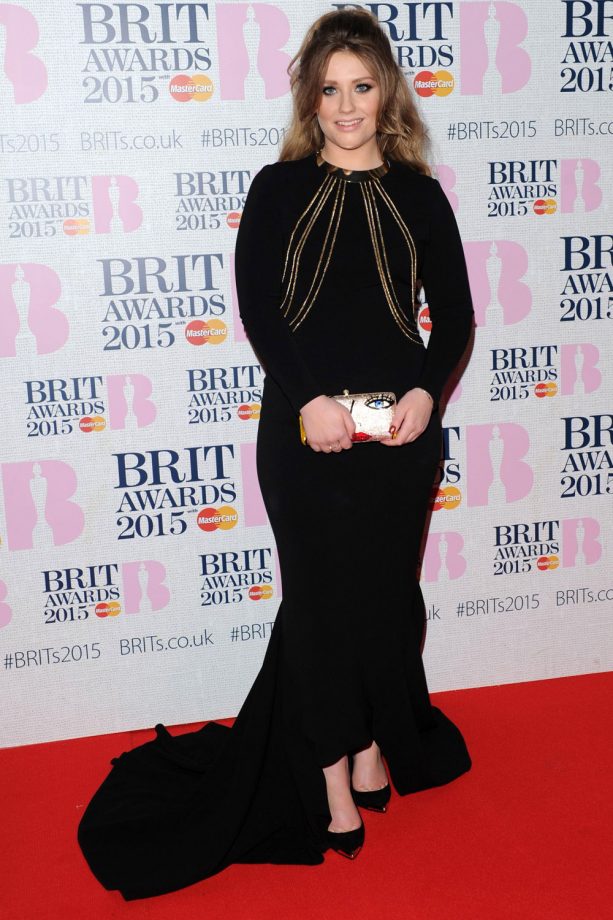 Ella Henderson Wears A Black Floor Length Gown To The Brit Awards In London, 2015