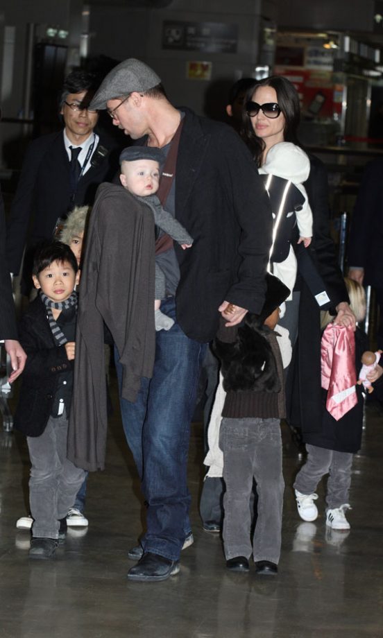 Angelina Jolie And Brad Pitt Arrive At Japan's Narita Airport With Their Entire Brood, January 2009