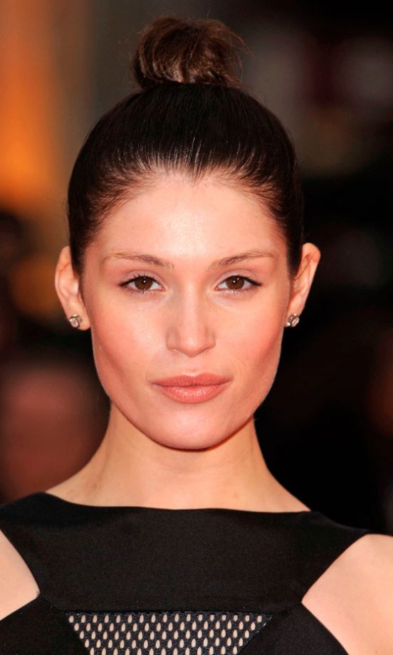 Gemma Arterton Works A Simple Topknot Hairstyle On The Red Carpet, 2010