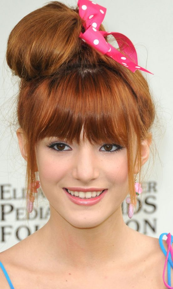 Festival Hairstyle: Bella Thorne Gave Her Top Knot Hairstyle A Fun Edge With A Ribbon, 2011