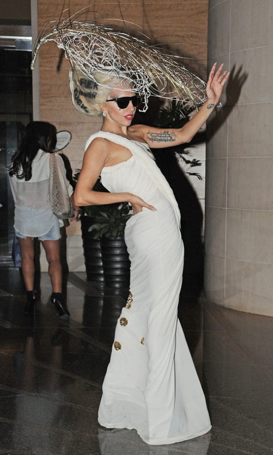 Lady Gaga Adds Interest To Her White Simple Dress With A Statement Hat, 2011