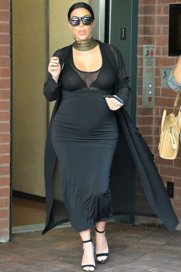Kim Kardashian Injects Some Edge Into Her Outfit By Teaming A Stacked Choker With A Black Stretch Midi Dress, 2015