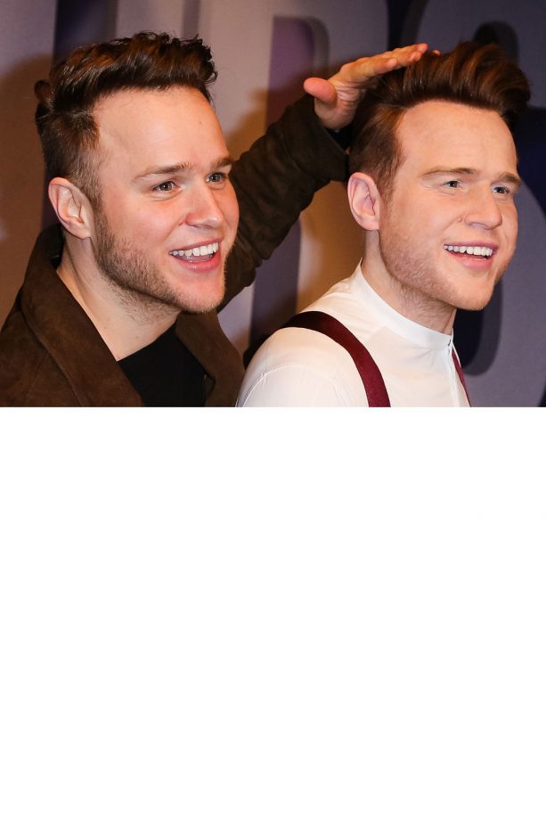 Olly Murs Checks The Height Of His Hair Is Perfect On His Waxwork Figure In London, 2015
