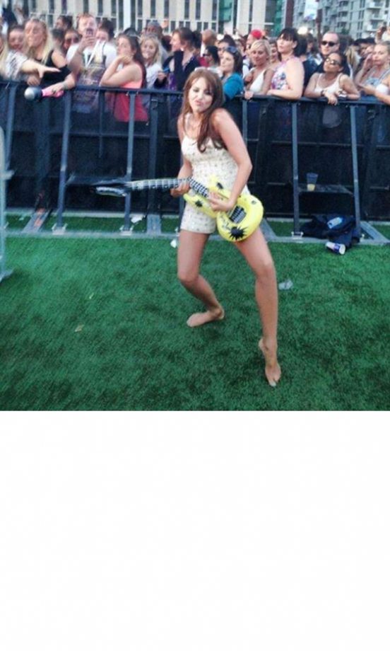 Lydia Bright Gets Involved In The Air Guitar Competition Backstage At Wireless. She'll Probably Win, She's The Only One In It, 2013
