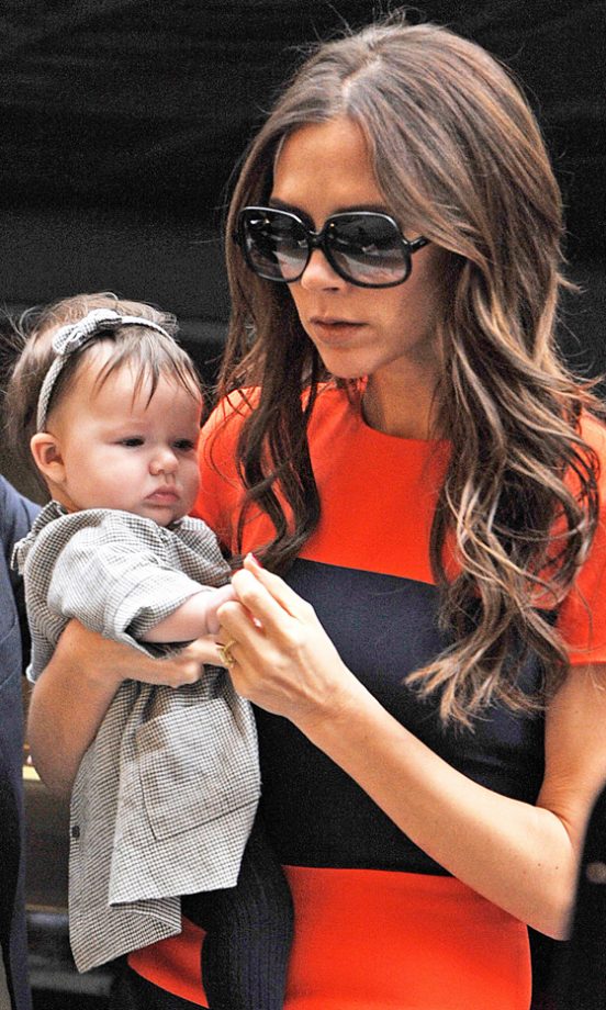 Victoria Beckham Clings On To Tiny Daughter Harper At Benihana In New York, 2011
