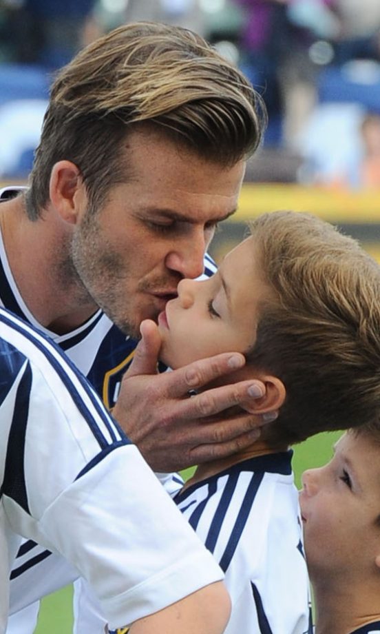 David Beckham Gives Son Romeo A Smooch At An LA Galaxy Match In LA, 2012