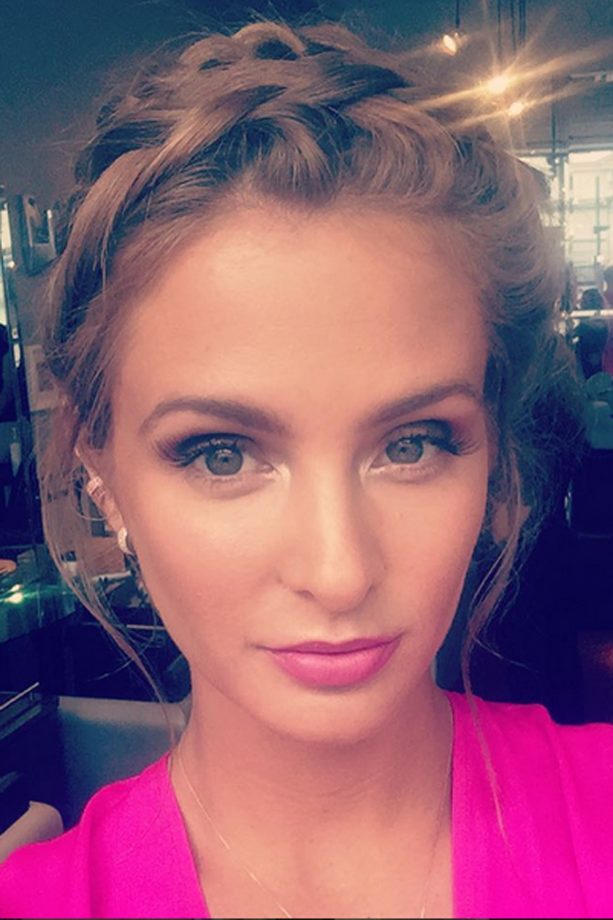 Millie Mackintosh works a braided updo at a friend's wedding, 2015