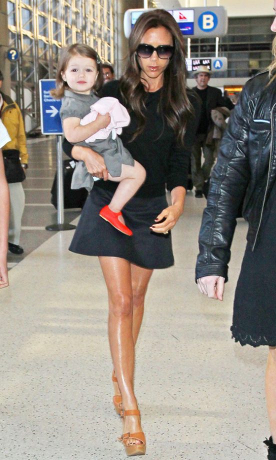 Victoria Beckham Arriving With Harper Beckham At LAX Airport, 2013