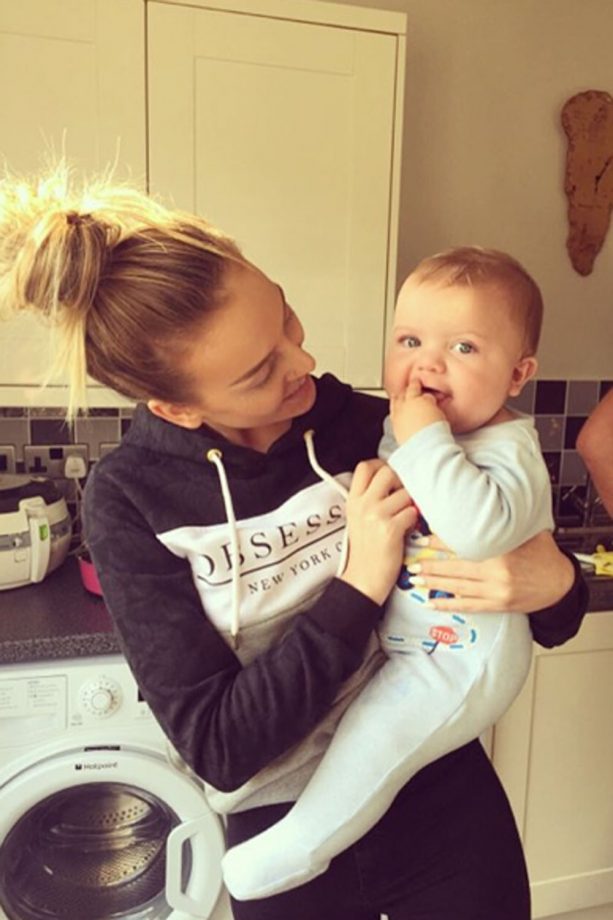 Perrie Edwards Cuddles An Adorable Baby, 2015