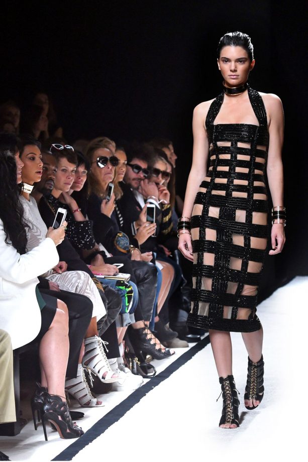 Kim Kardashian And Kanye West Watch Kendall Walk For Balmain At Paris Fashion Week, 2014