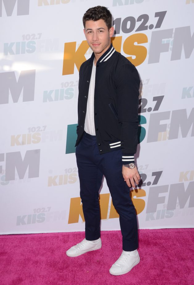 Nick Jonas Wears A Classic Baseball Jacket To KIIS FM's Wango Tango, 2015