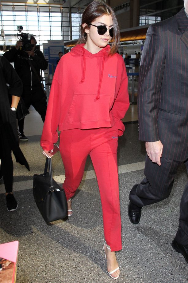 Selena Gomez Breaks All The Fashion Rules (And Pulls It Off) By Pairing A Red Tracksuit With Heels, 2016