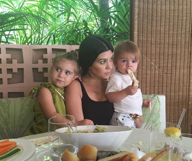 Sister Kourtney with her two children, Penelope and Reign...
