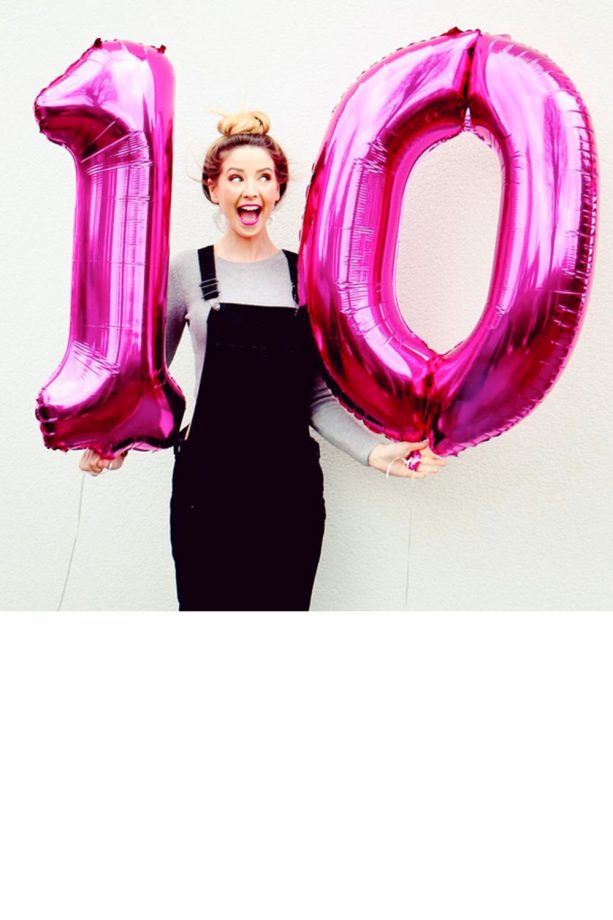 Zoella Works A Top Knot And Bright Pink Lipstick, 2016