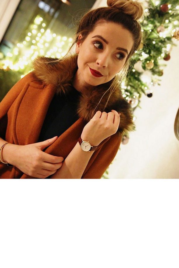 Zoella Keeps It Simple With A Messy Top Knot And Red Lipstick, 2015
