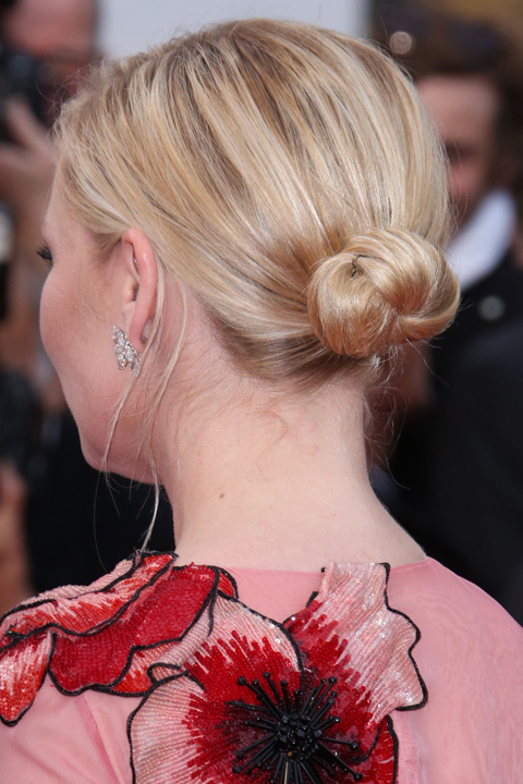 Kirsten Pulls Her Hair Into A Smooth Ballet Bun