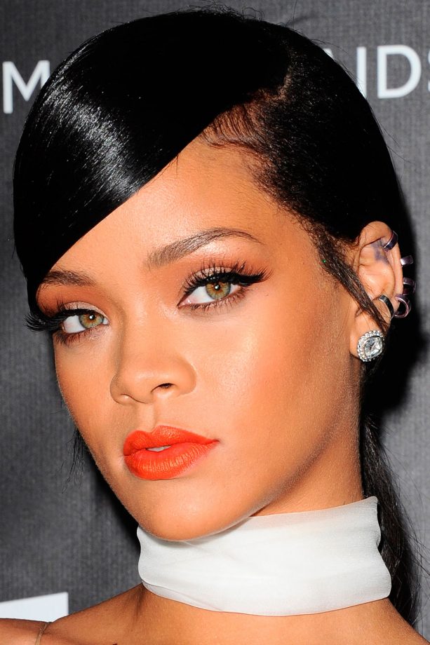 Rihanna Is Super Sexy With Slicked Fringe, Slender Lashes And A Bright Orange Lip, 2014