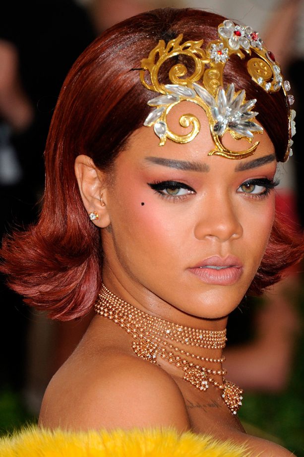 Rihanna Working A Short Red Flicked Bob With Dramatic Brows And Playful Beauty Spot, 2015