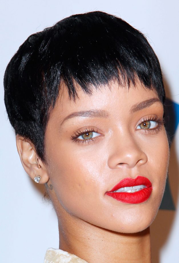 Rihanna Makes A Bold Statement With A Black Pixie Cut, Natural Eyes And A Bright Red Lip, 2012