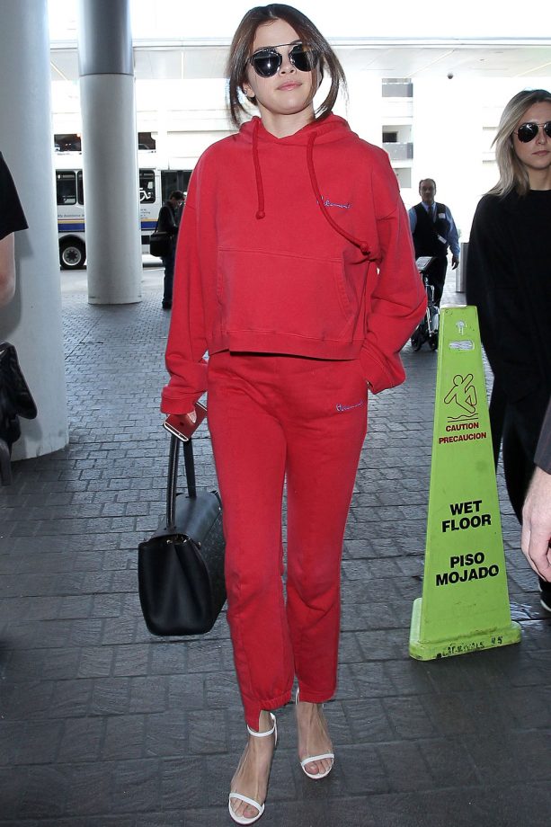 Selena Gomez Working A Sporty Red Combo At LAX International Airport, Los Angeles, 2016