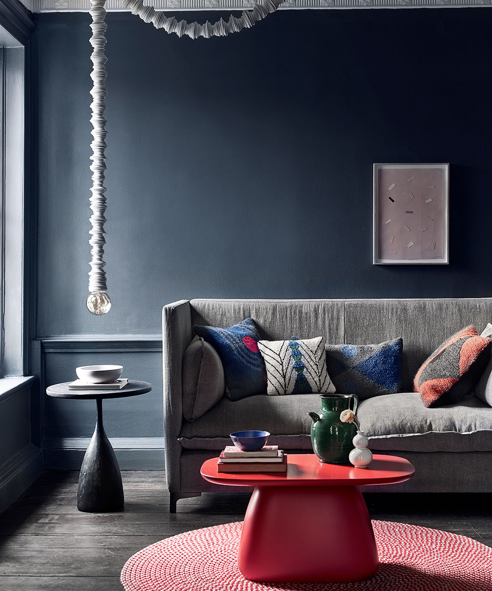 Moody grey living room with bold, bright furniture | Homes & Gardens